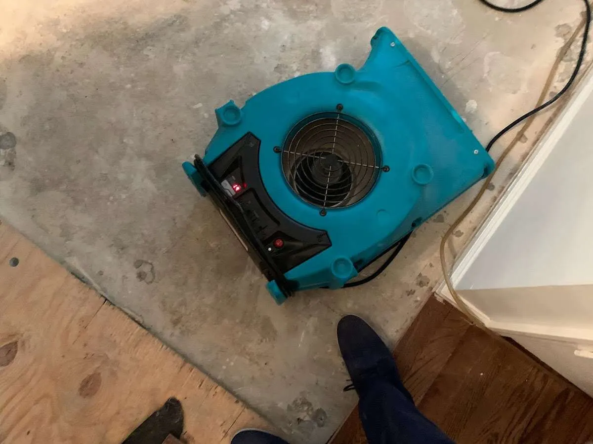 Air mover drying subfloor during Leak Detection & Repair in East Lampeter